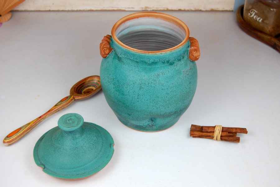 Turquoise pottery honey pot
